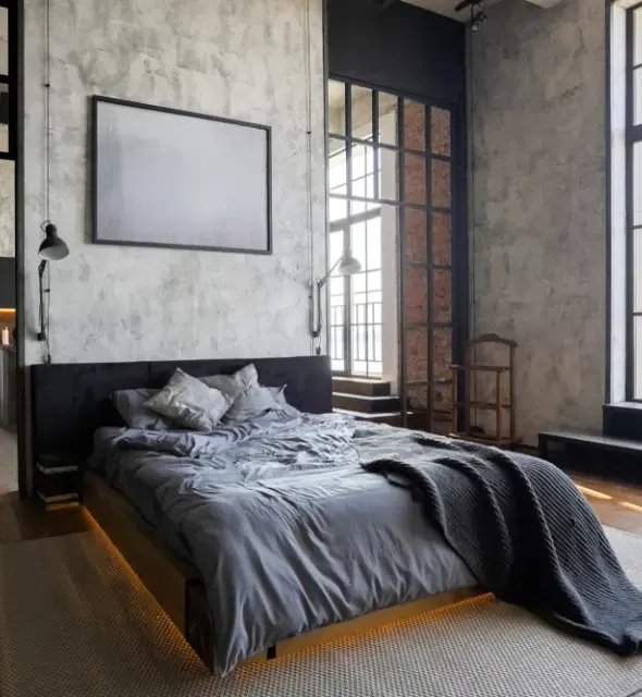 Studio de luxe avec un aménagement gratuit dans un style loft aux couleurs sombres.